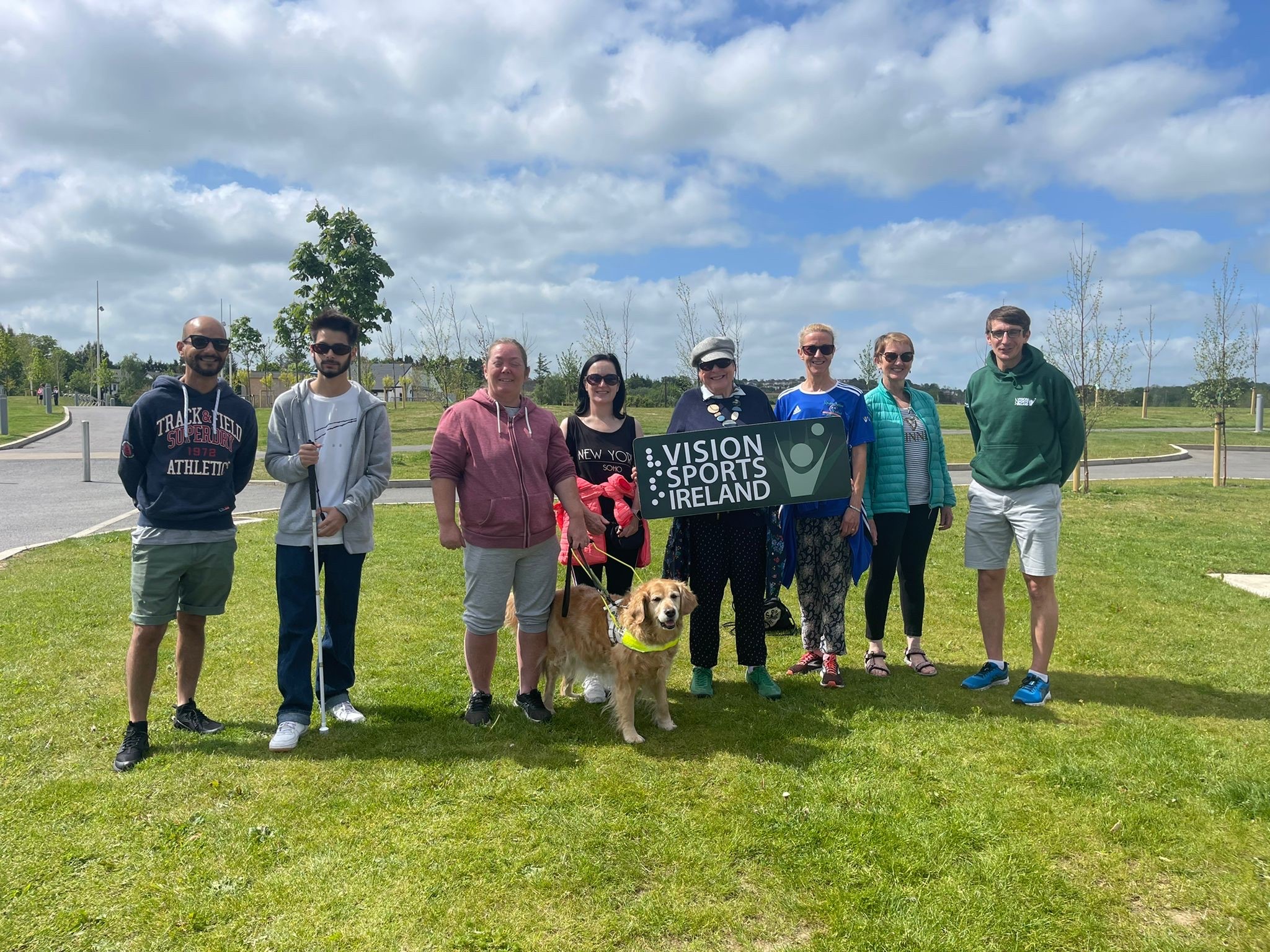 Wexford walking participants standing in a park.