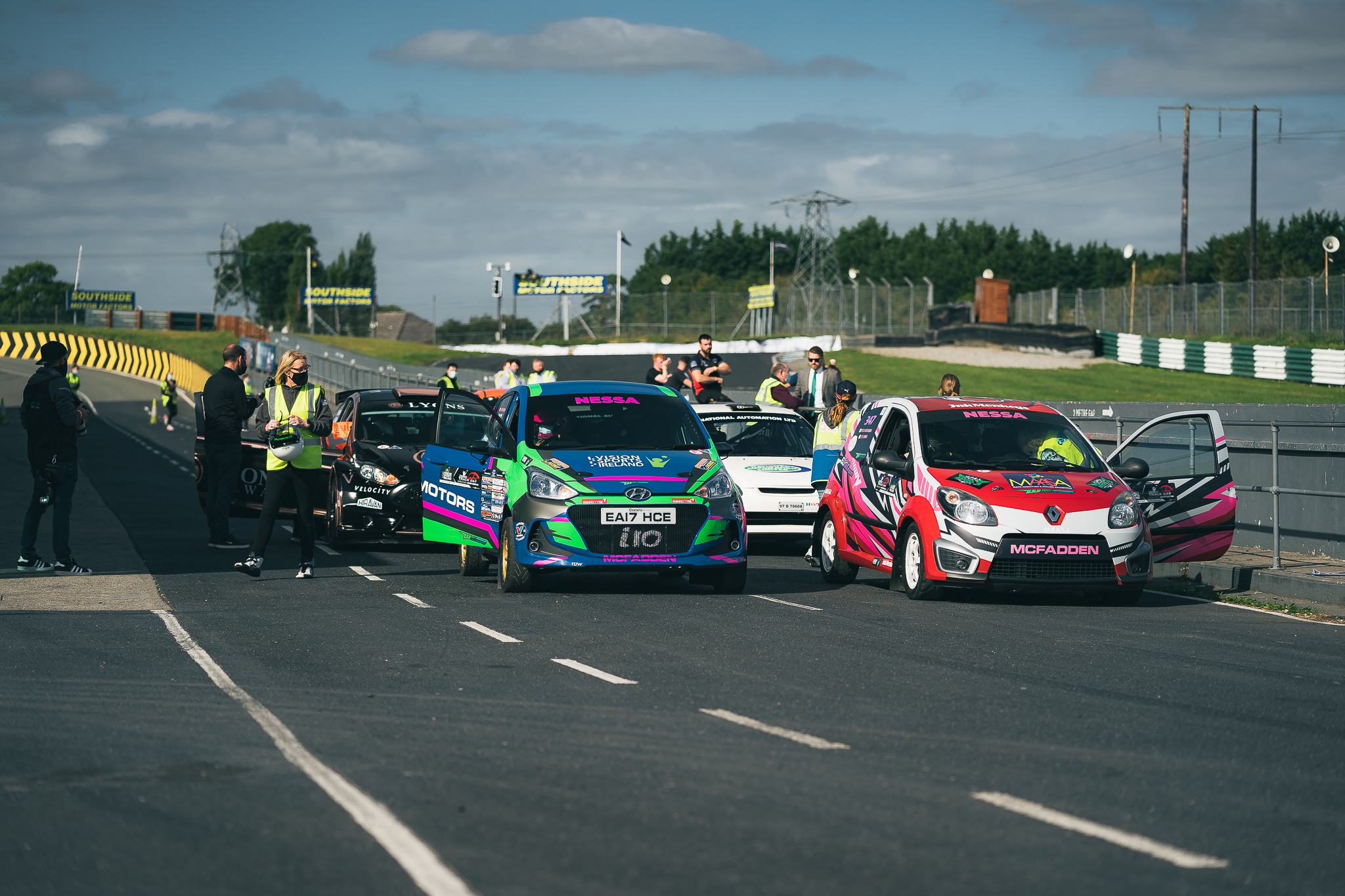 A group of rally cars ready to bunch up and take off at a Vision Sports Ireland motorsport event