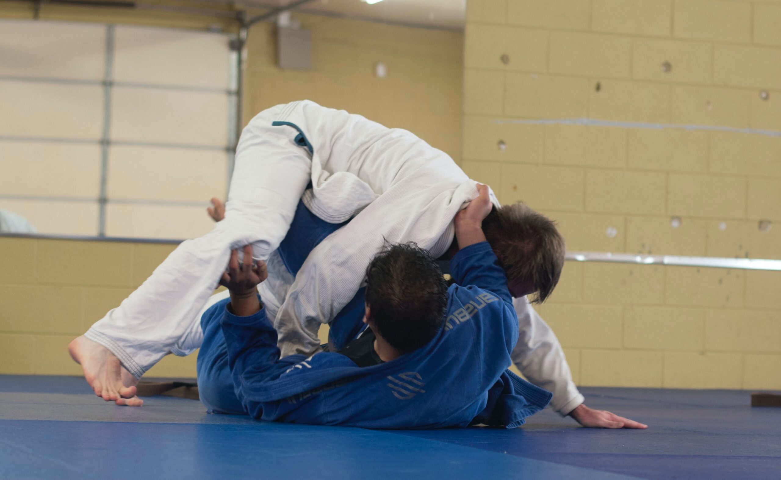 Photo of two people practicing judo.