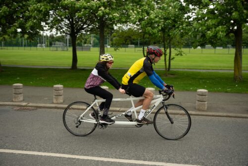 Pilot and stoker on a tandem bike