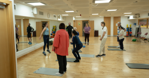 Photo of participants taking part in exercise class.