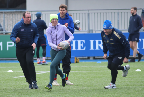 Photo of members taking part in vision impaired rugby.