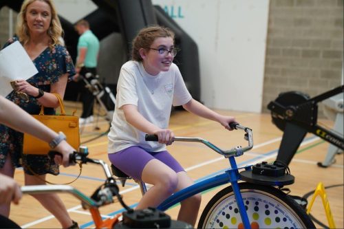 A child mid cycle on a stationary bike