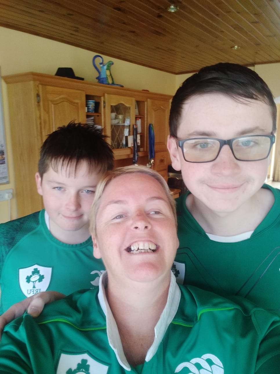 A selfie of Treacy and her 2 sons wearing irish jerseys