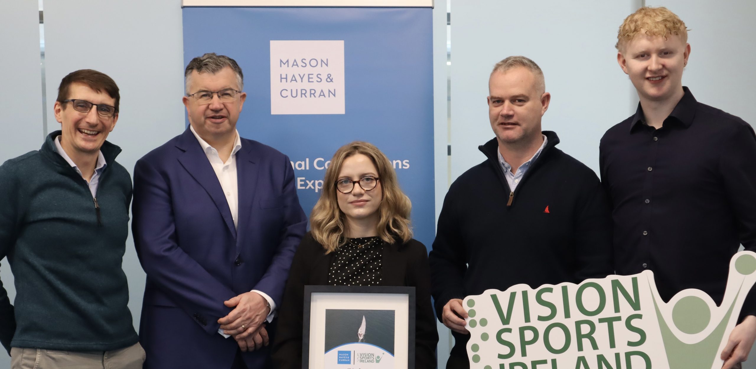 Vision Sports team members with 2025 Bursary Recipient with MHC managing partner presenting Bursary award.